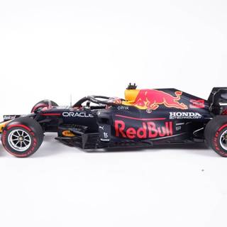 Zberateľský kovový model Red Bull RB16b - Max Verstappen (2021),  Víťaz VC Holandska,  1:18 Minichamps
